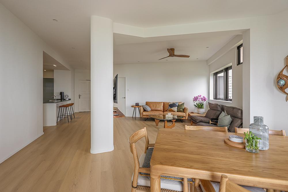 Country Living Room with Wood Flooring and Open Kitchen