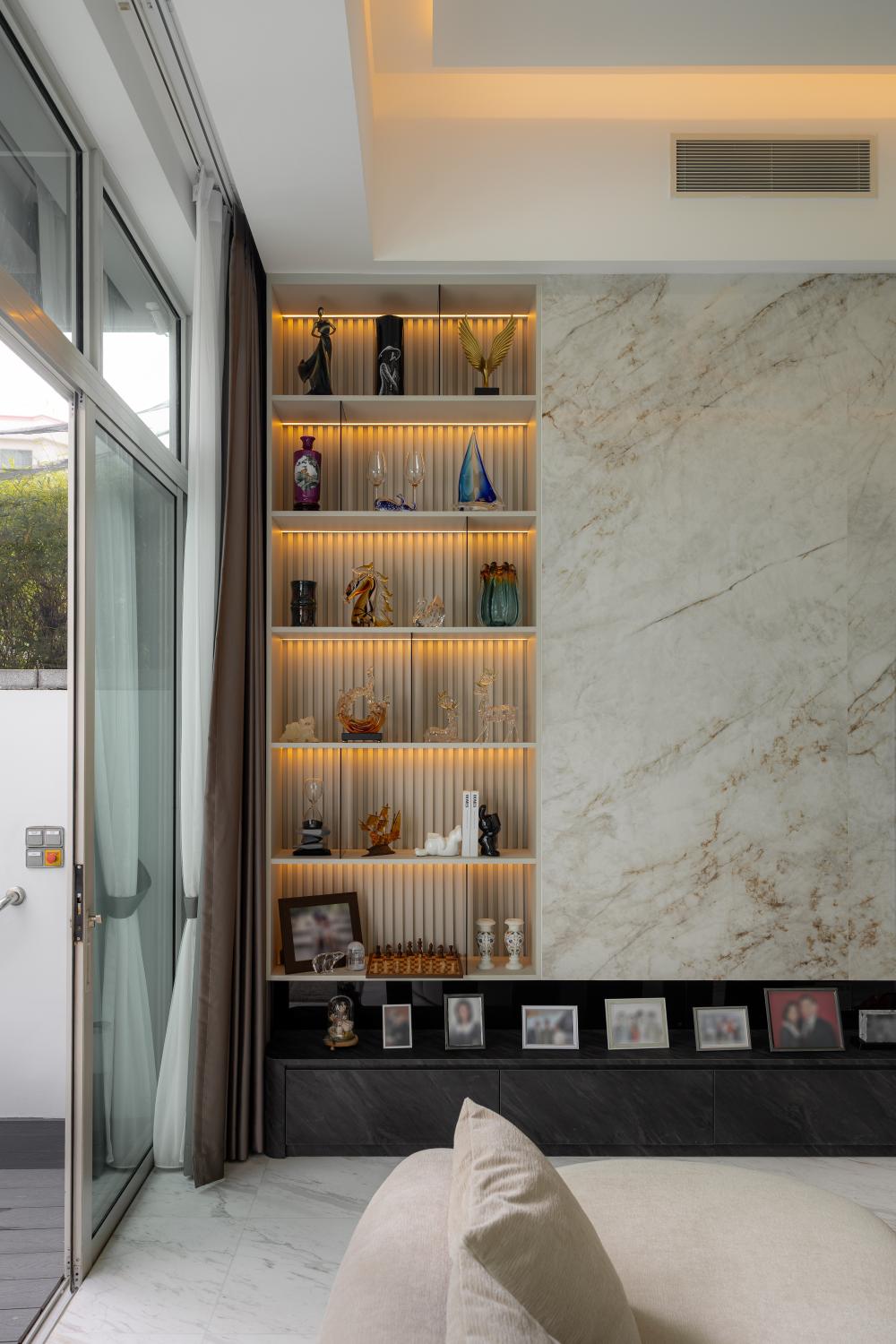 Contemporary Living Room with Bookshelf and Feature Wall