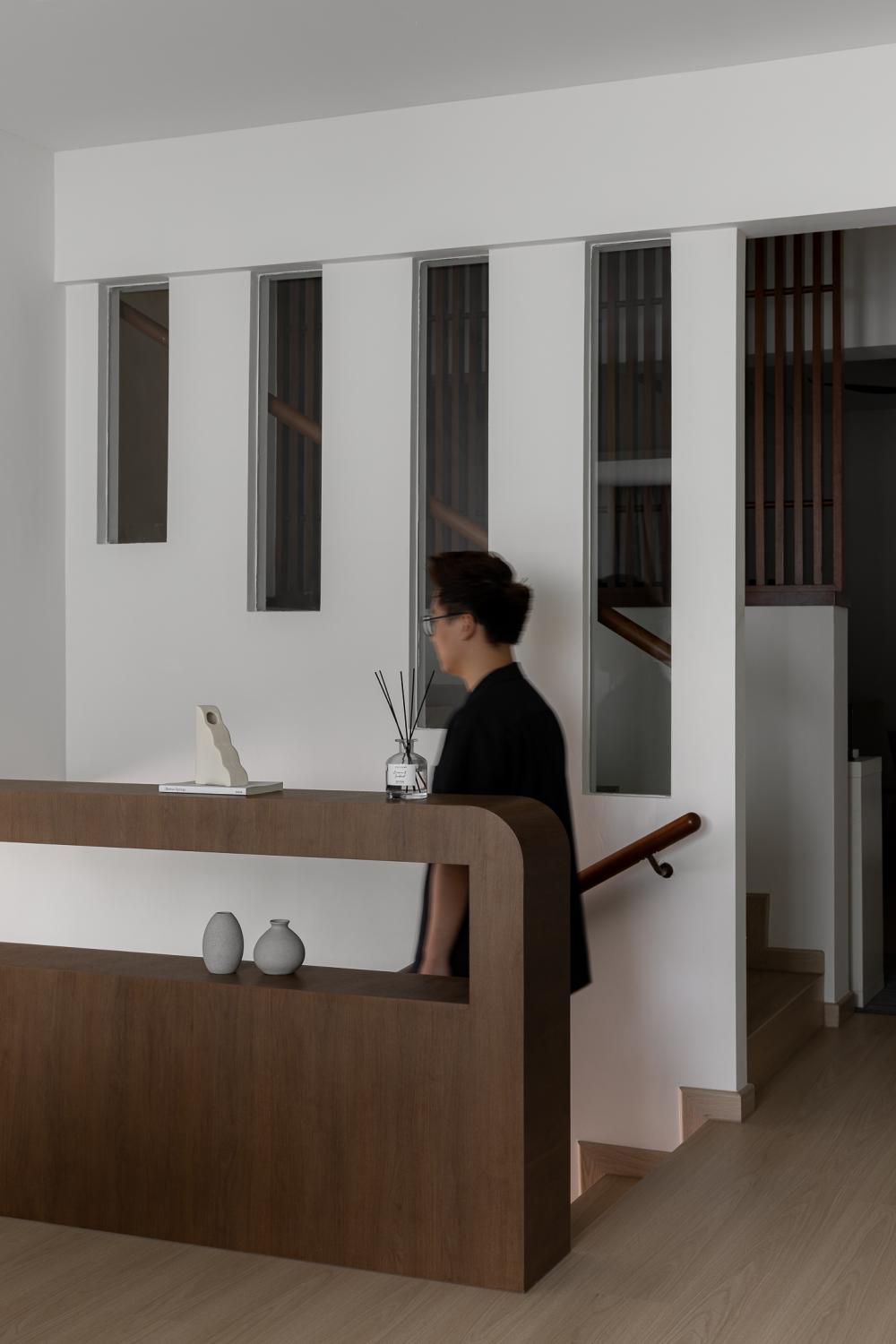 Contemporary Hallway with Bookshelf and Artwork