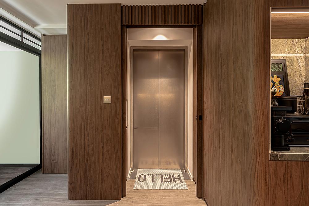 Modern Foyer with Feature Wall and Storage Cabinets