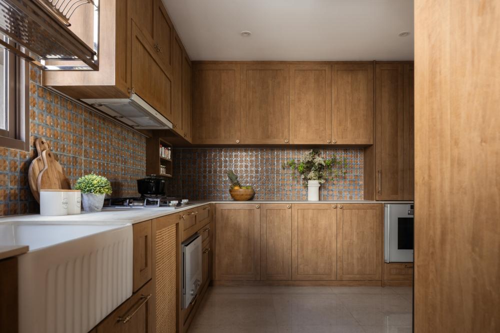 Asian Kitchen with Homogeneous Tiles and Cupboard