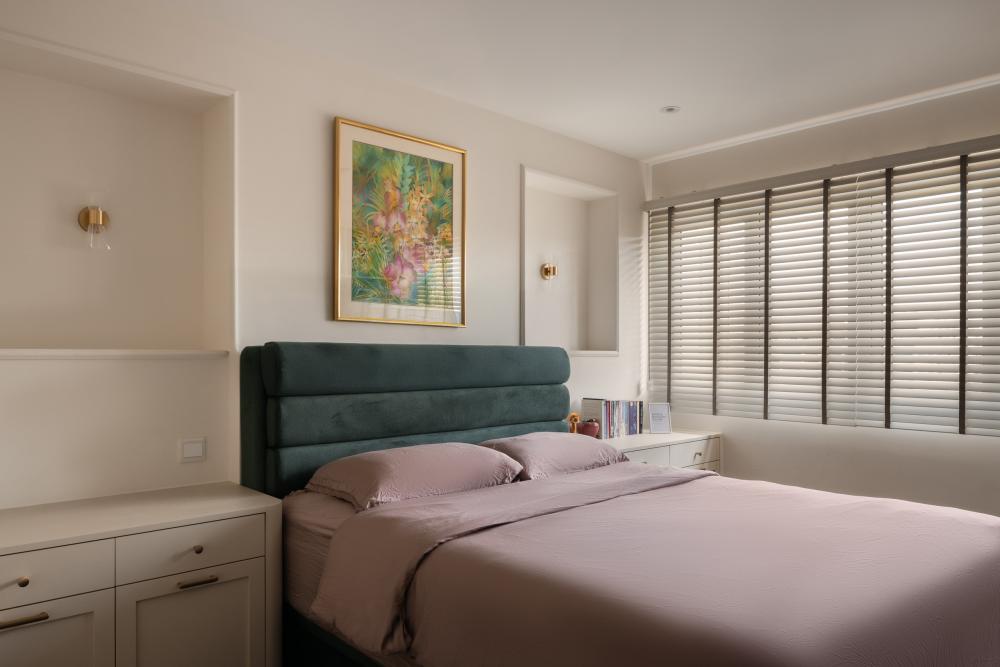 Modern Bedroom with Paintings and Storage Cabinets