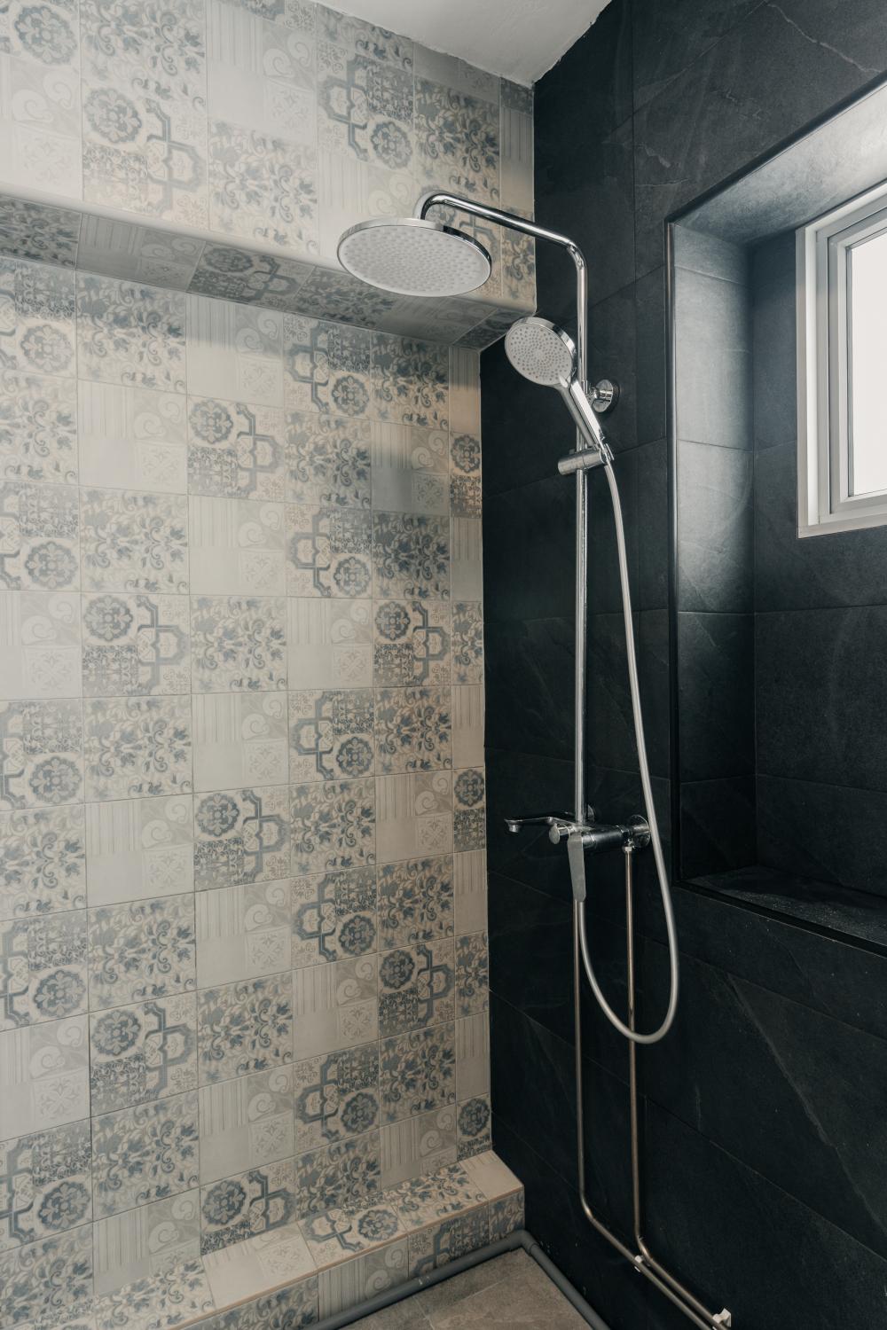 Country Bathroom with Homogeneous Tiles and Rainshower
