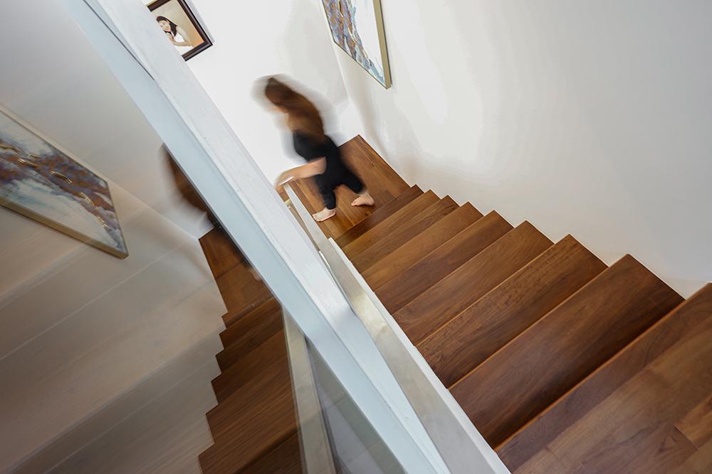 Modern Hallway with Staircase and Artwork