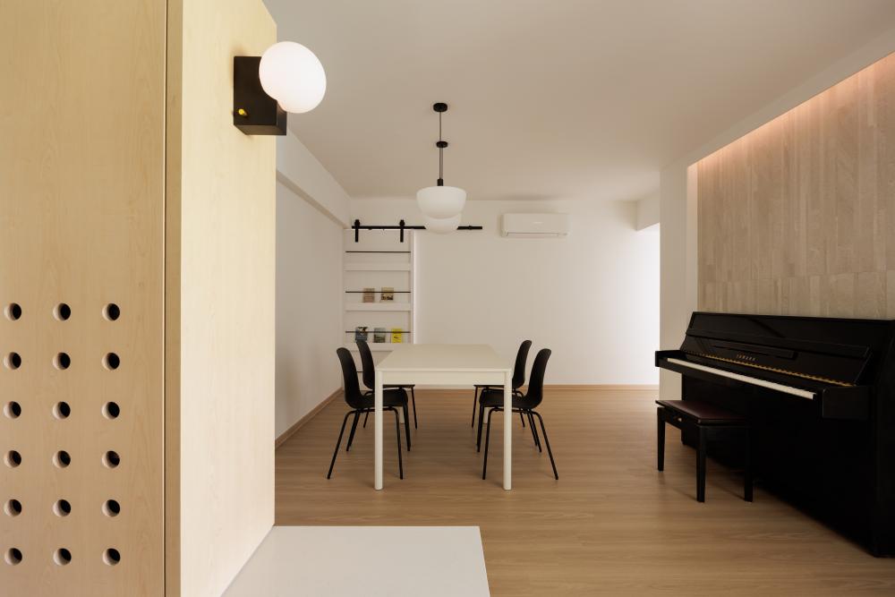 Minimalist Living Room with Bookshelf and Feature Wall