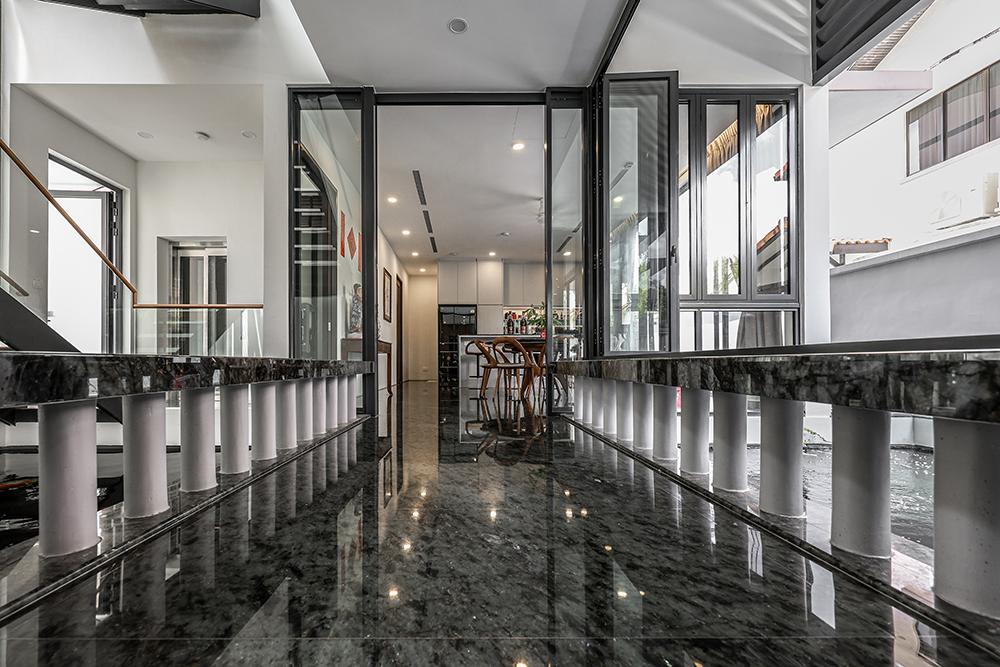 Modern Hallway with Granite Floor and Glass Door