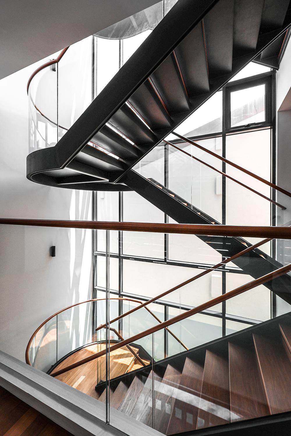 Modern Hallway with Staircase and Paintings