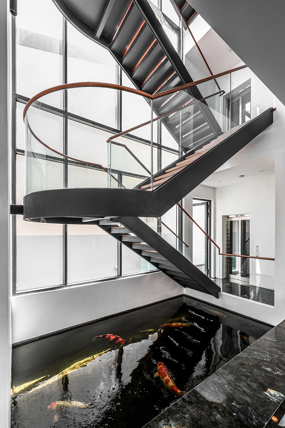 Modern Hallway with Staircase and Glass Door