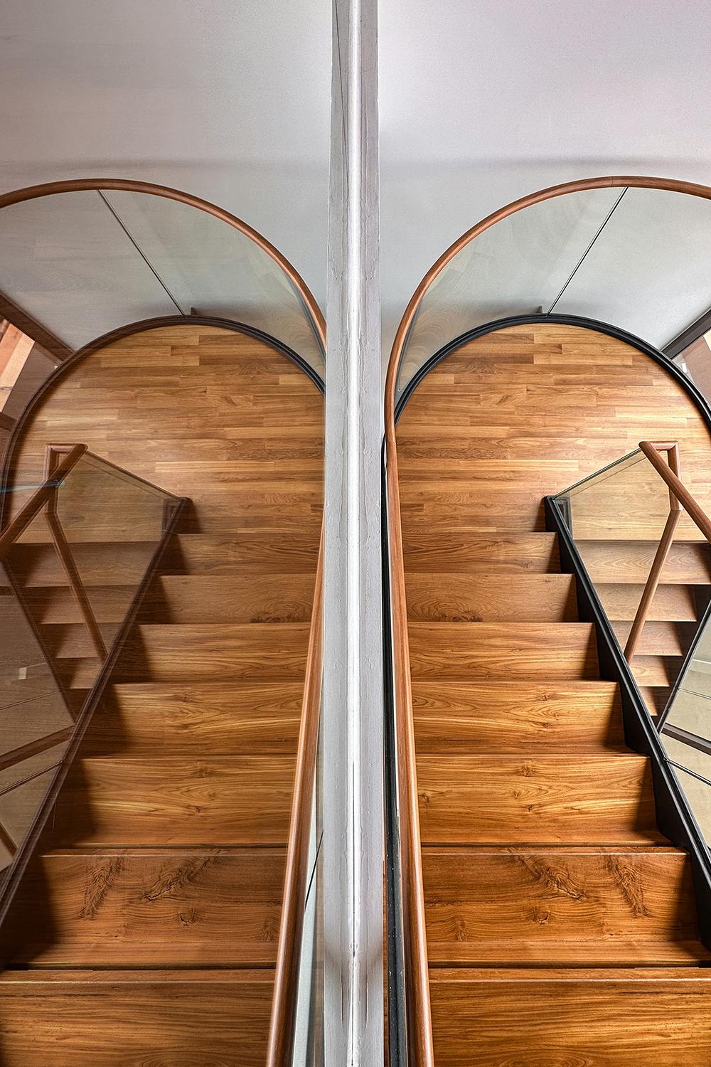 Modern Hallway with Staircase and Paintings