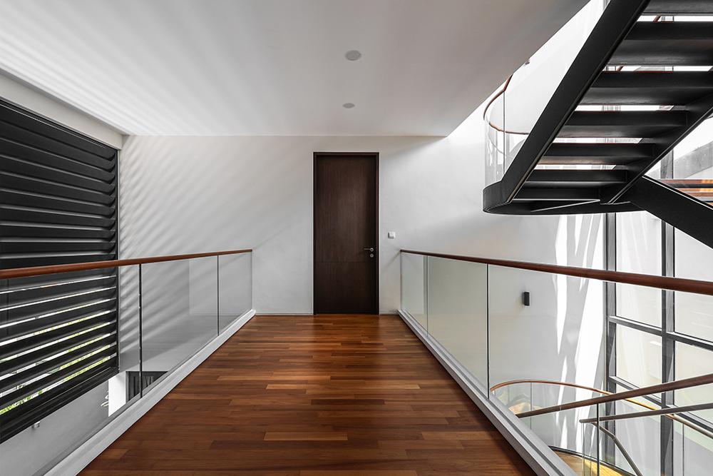 Modern Hallway with Parquet Floor and Paintings