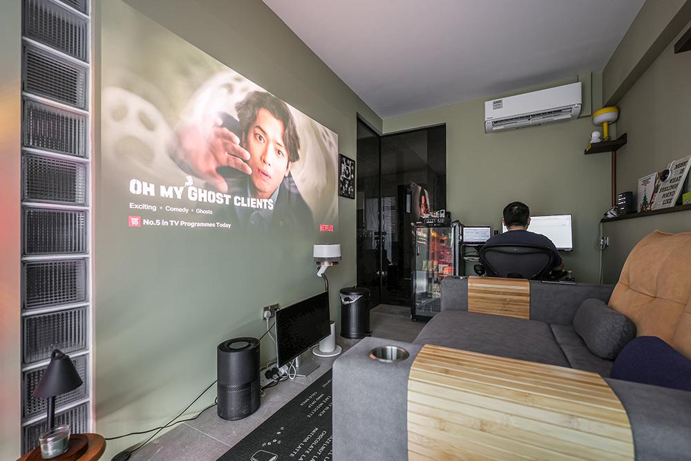 Eclectic Home Theatre with Sofa and Paintings