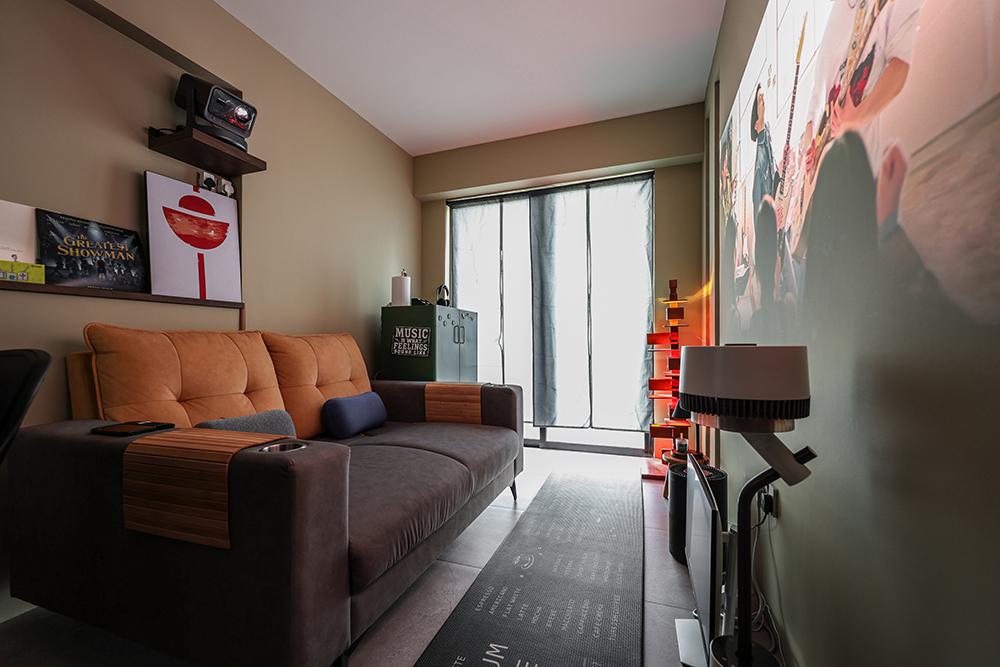 Eclectic Home Theatre with Sofa and Paintings