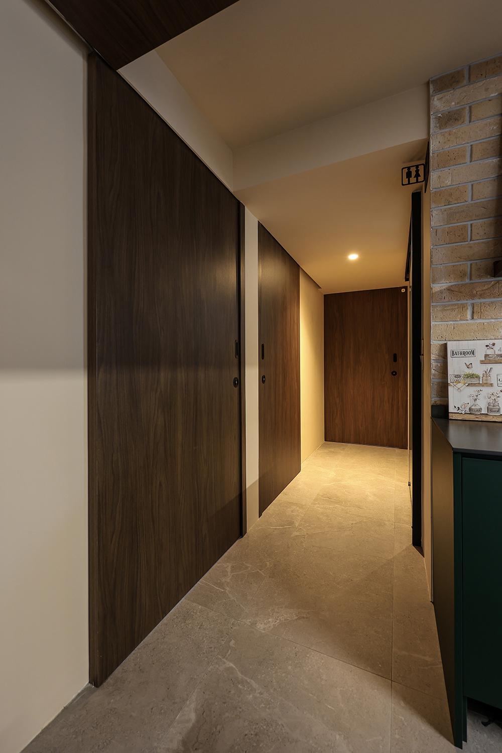 Eclectic Hallway with Homogeneous Tiles and Doors