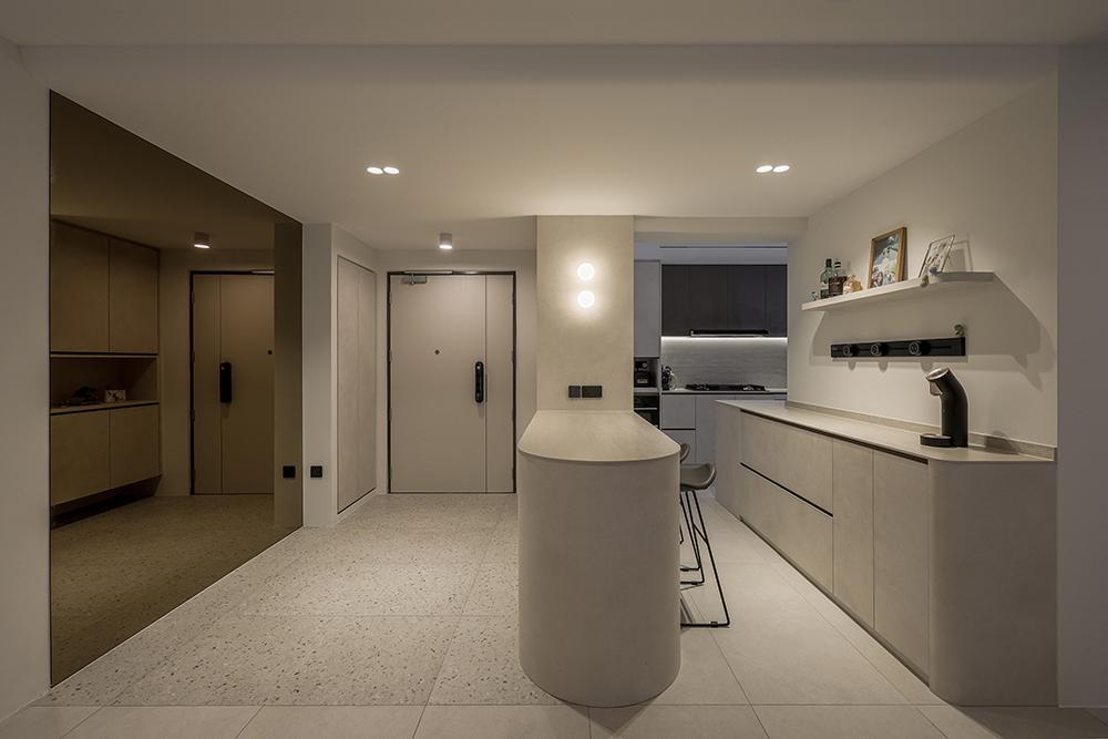 Modern Foyer with Homogeneous Tiles and Mirror
