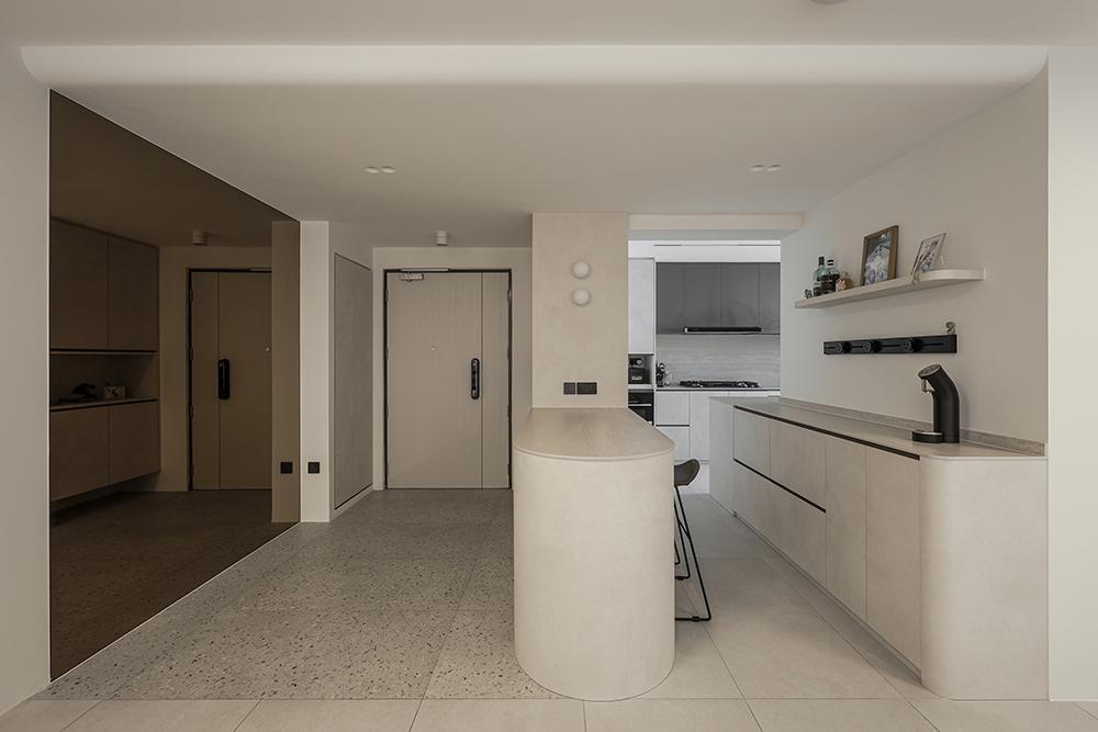 Modern Foyer with Homogeneous Tiles and Mirror