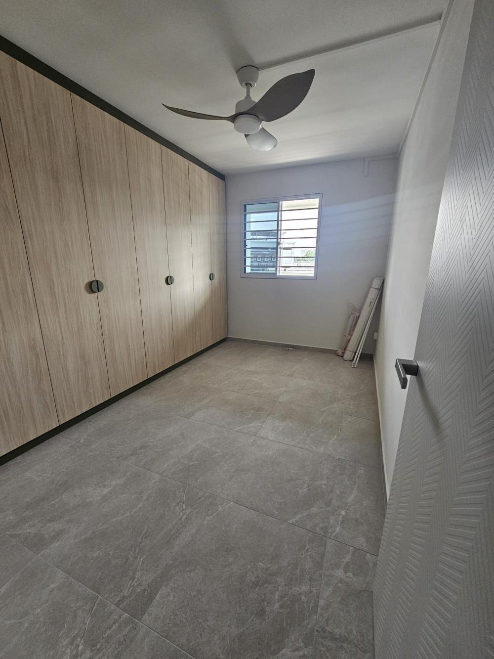 Minimalist Bedroom with Wardrobe and Porcelain Tiles