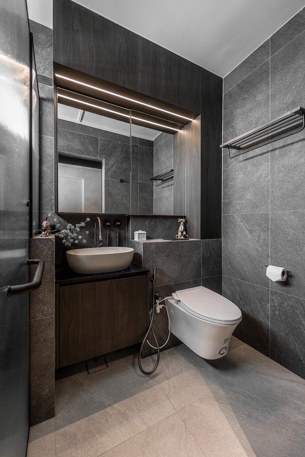 Industrial Bathroom with Homogeneous Tiles and Mirror