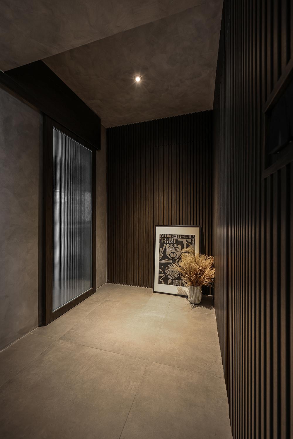 Industrial Hallway with Homogeneous Tiles and Feature Wall