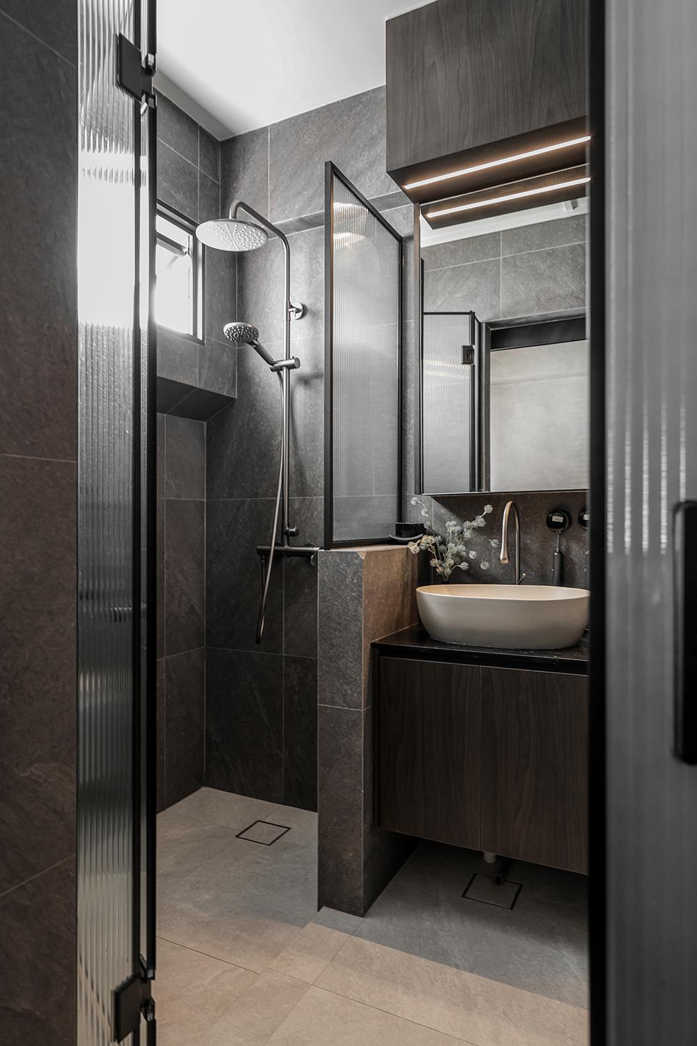 Industrial Bathroom with Homogeneous Tiles and Mirror