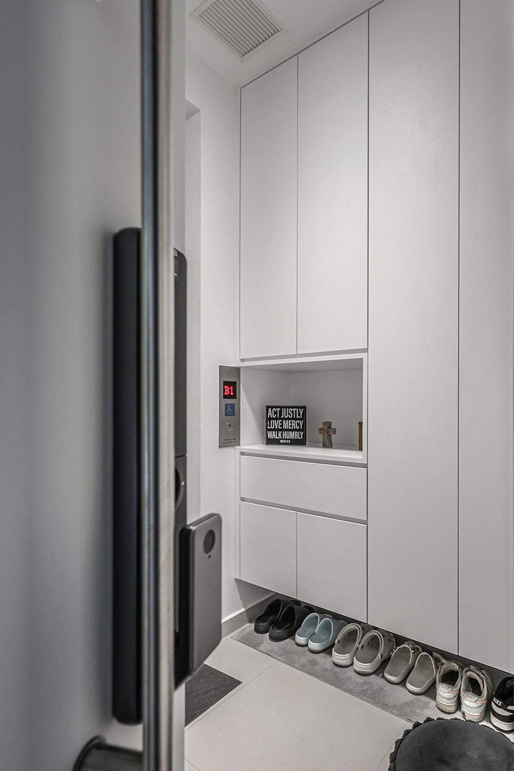 Minimalist Foyer with Display Cabinets and Shoe Cabinets