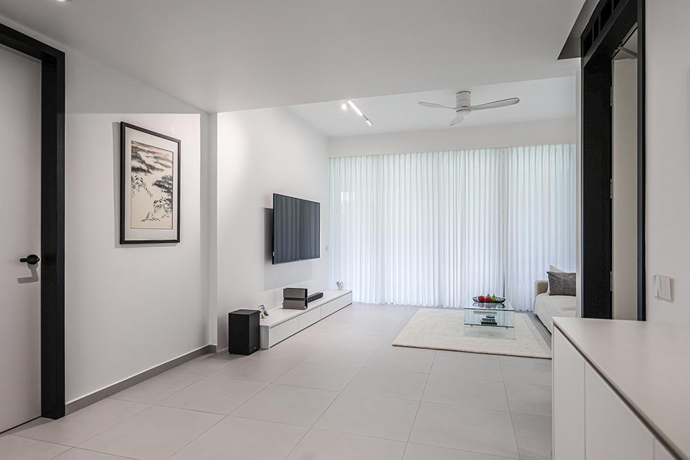 Minimalist Living Room with Homogeneous Tiles and TV Console