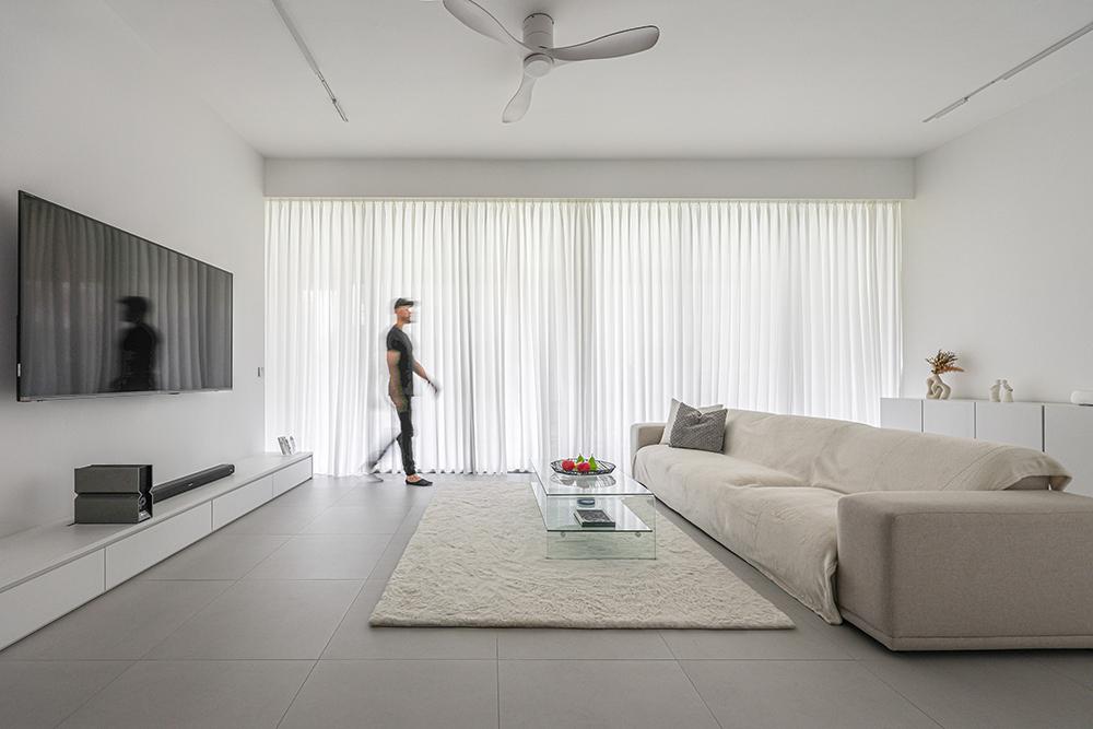 Minimalist Living Room with Homogeneous Tiles and TV Console