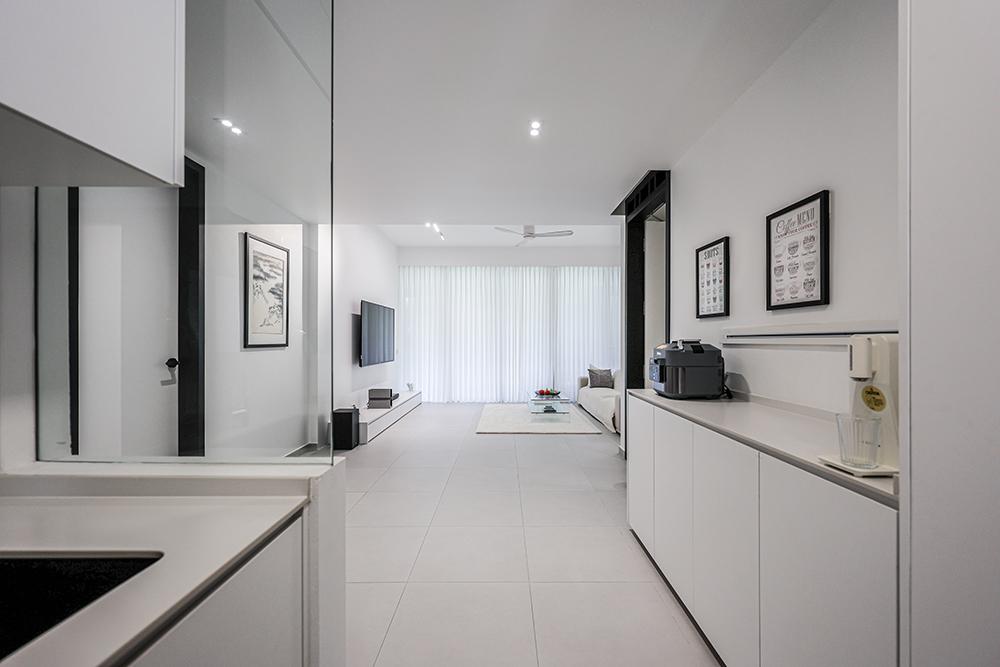 Minimalist Living Room with Homogeneous Tiles and TV Console