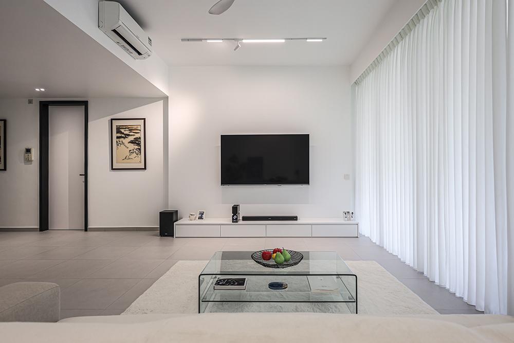 Minimalist Living Room with Homogeneous Tiles and TV Console