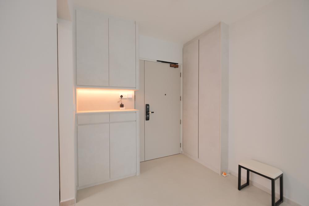 Minimalist Foyer with Artwork and Shoe Rack