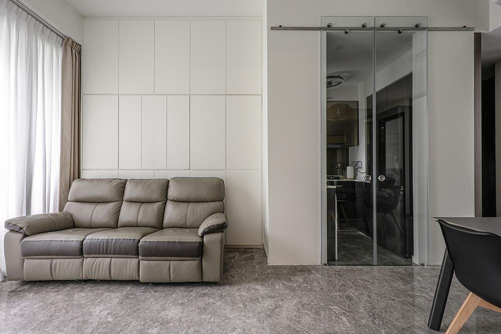 Modern Living Room with Glass Door and Storage Cabinets