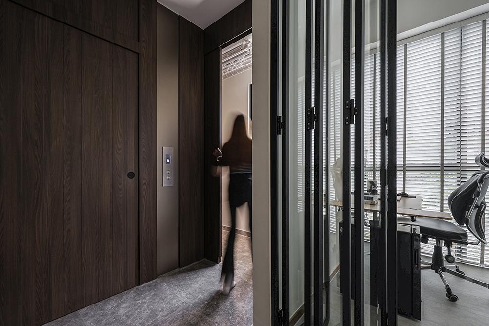 Modern Foyer with Feature Wall and Glass Door