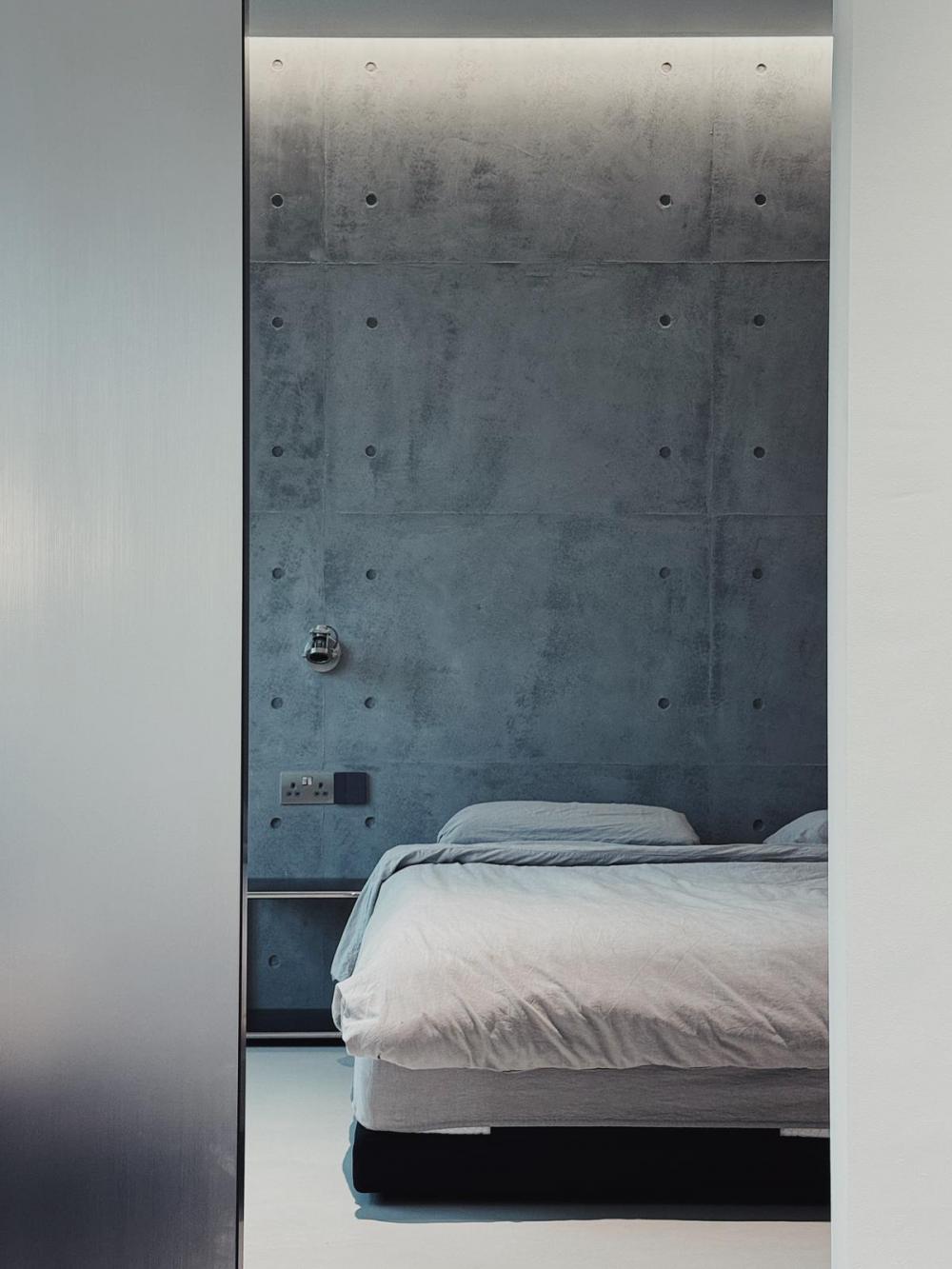 Industrial Bedroom with Feature Wall and Mirror
