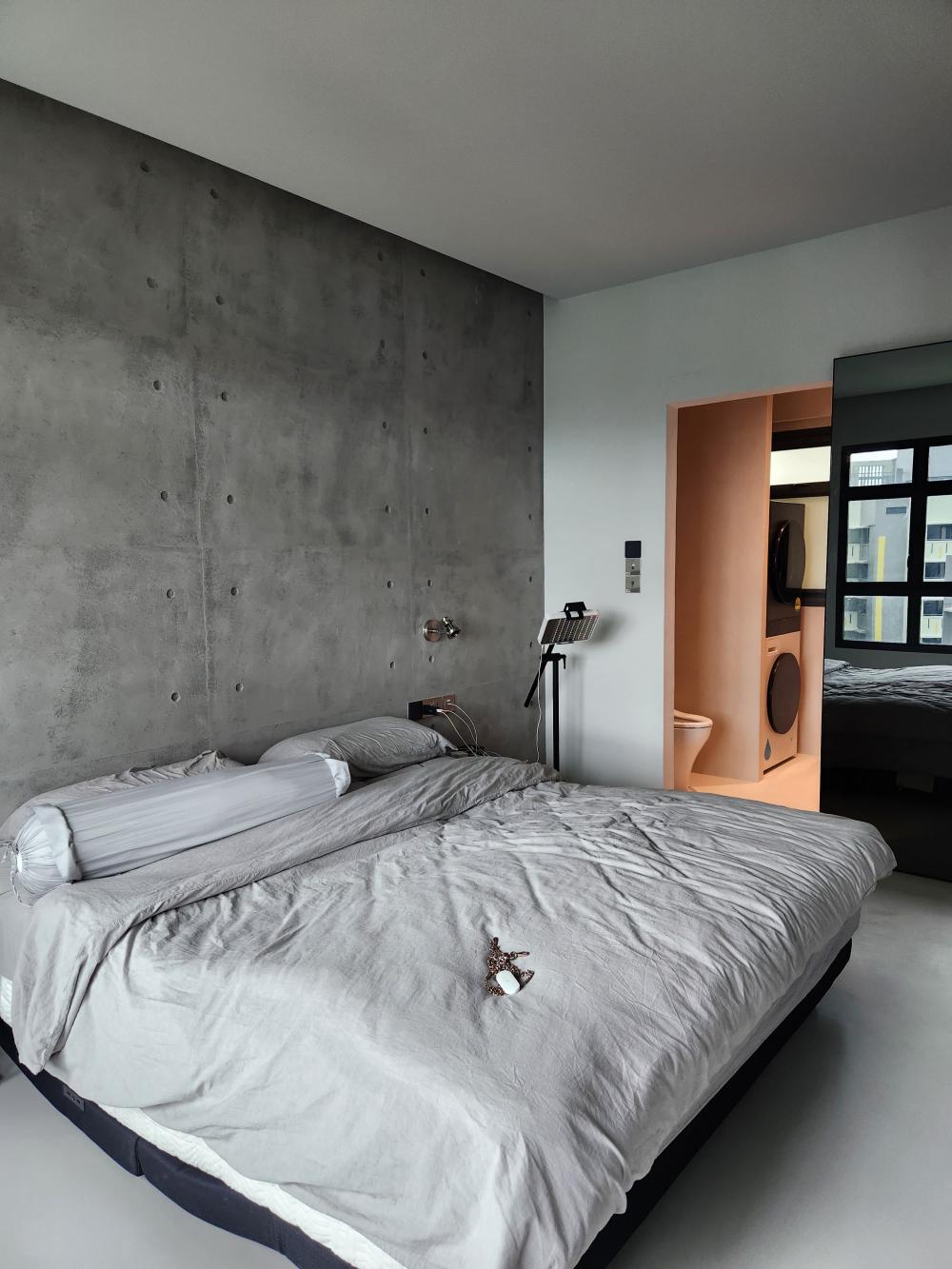 Industrial Bedroom with Cement Floor and Feature Wall