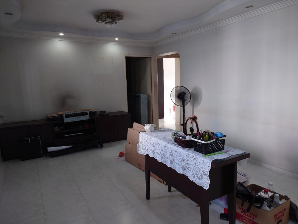 Asian Living Room with Bookshelf and Homogeneous Tiles