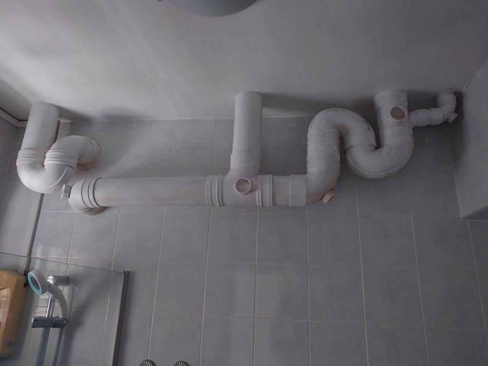 Asian Bathroom with Homogeneous Tiles and Mirror