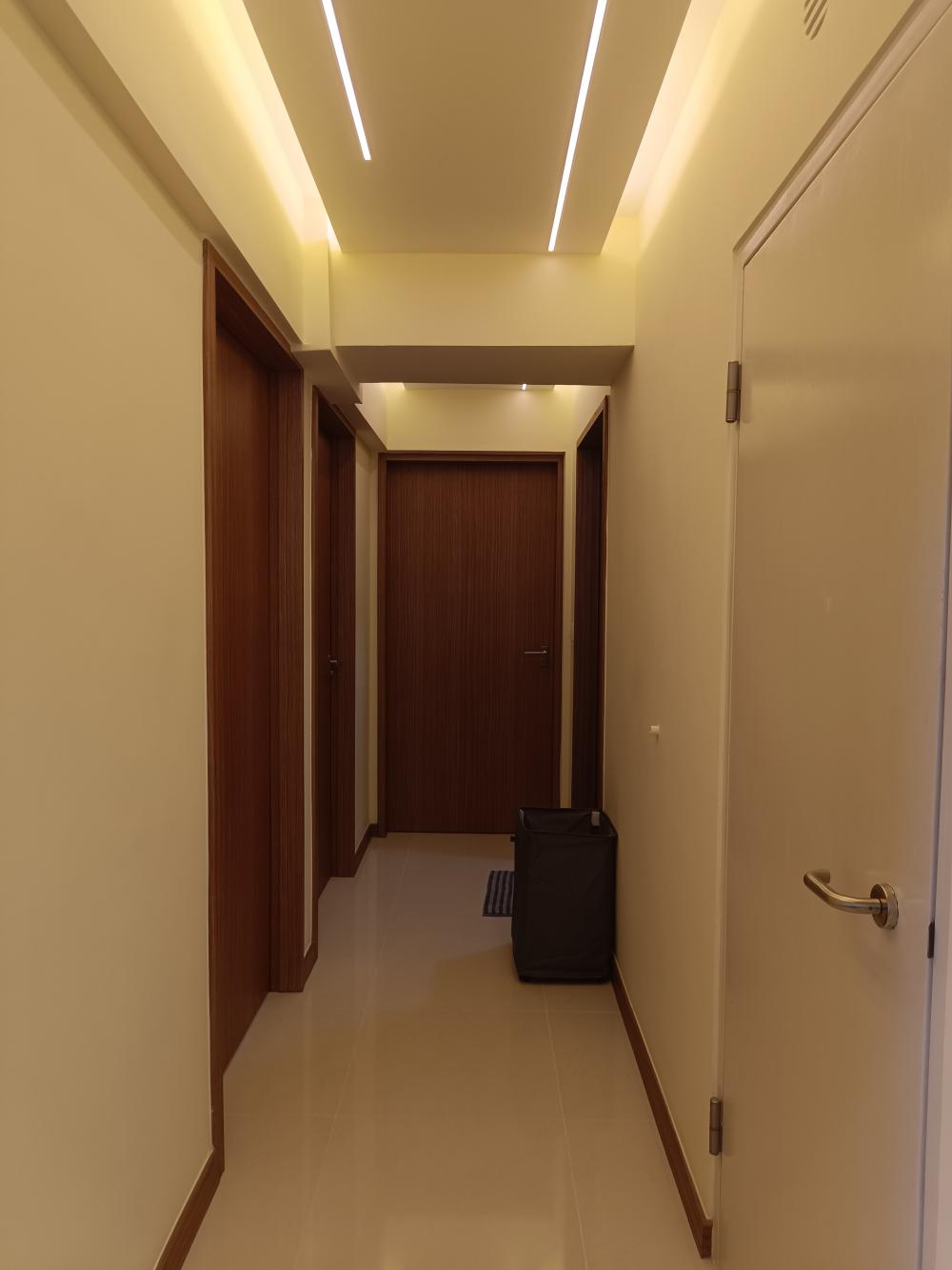 Modern Hallway with Cove Lighting and Drop Ceiling