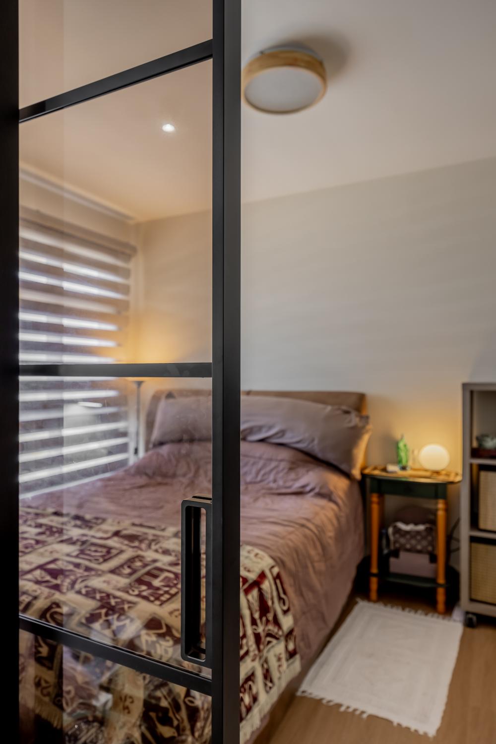 Contemporary Bedroom with Bookshelf and Vinyl Flooring
