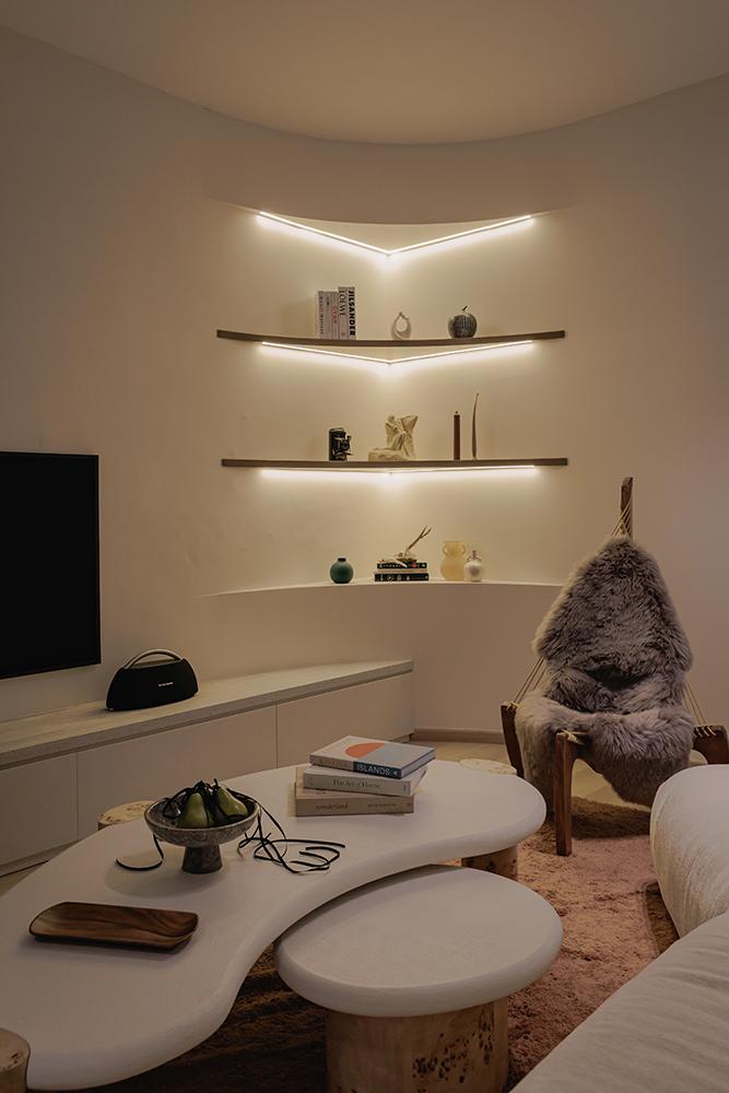 Minimalist Living Room with TV Console and Paintings