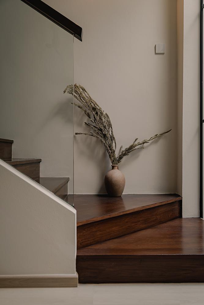 Minimalist Hallway with Staircase and Houseplants