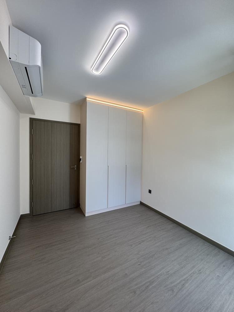 Modern Bedroom with Cove Lighting and Wardrobe