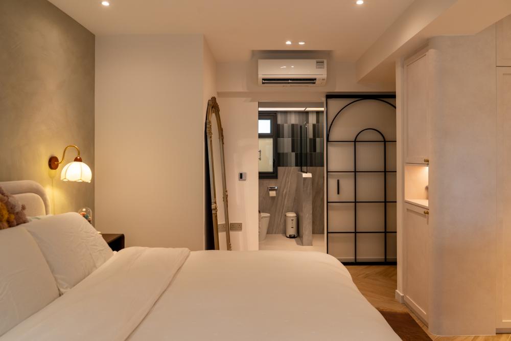 Country Bedroom with Herringbone Tiling and Feature Wall