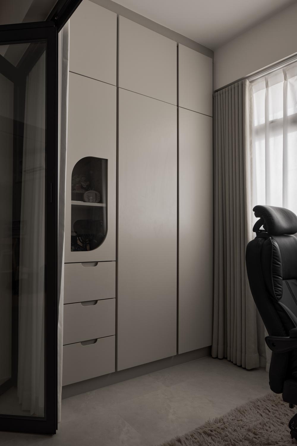 Contemporary Office with Bookshelf and Desk Chairs