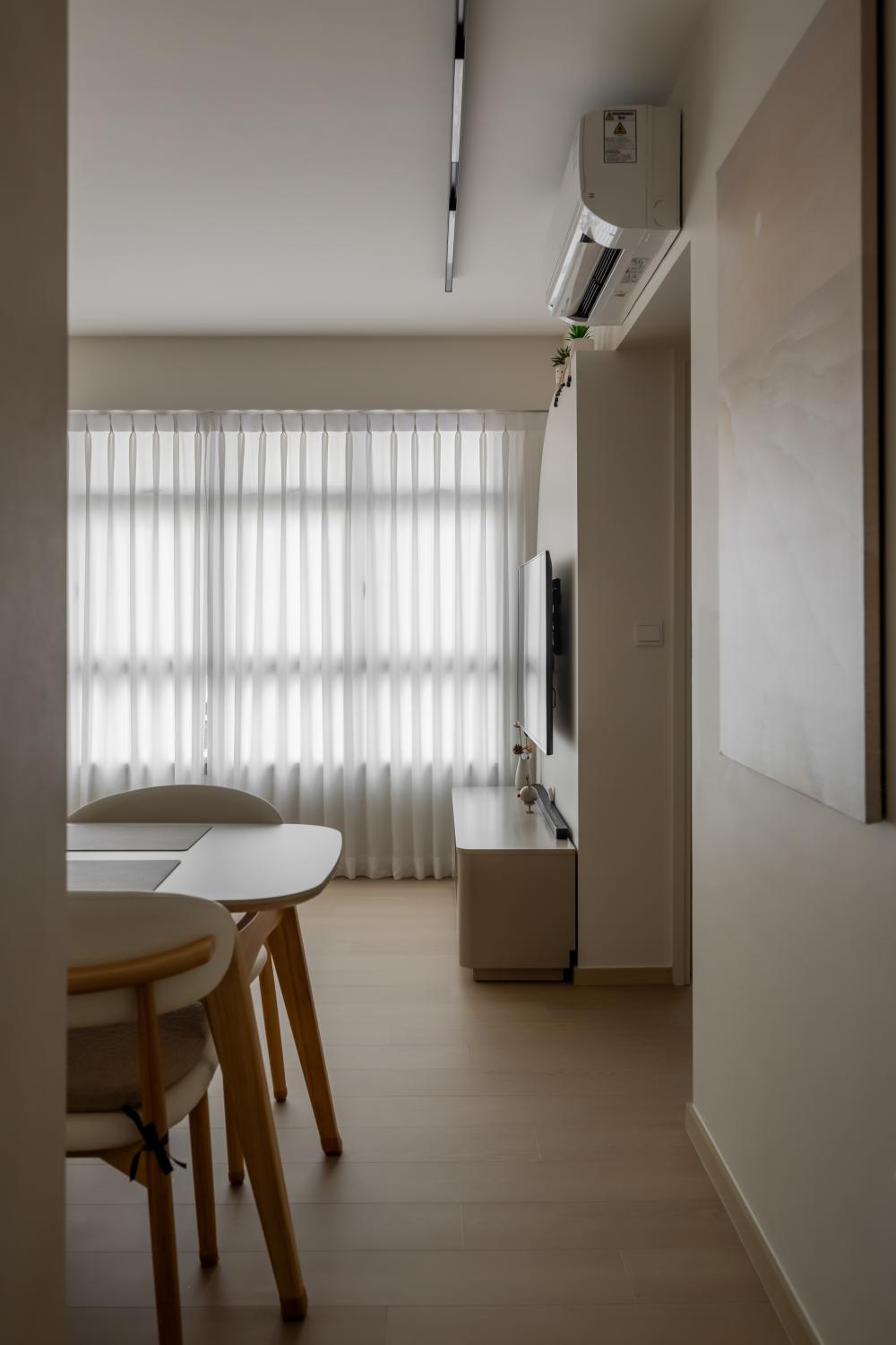 Minimalist Hallway with TV Console and Paintings