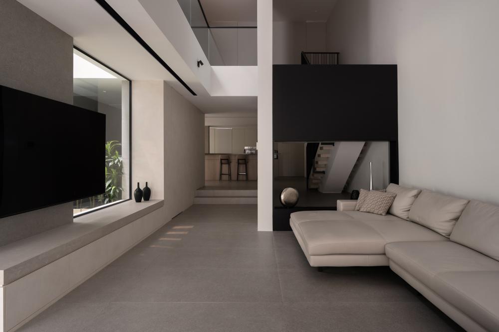 Contemporary Living Room with Homogeneous Tiles and TV Console