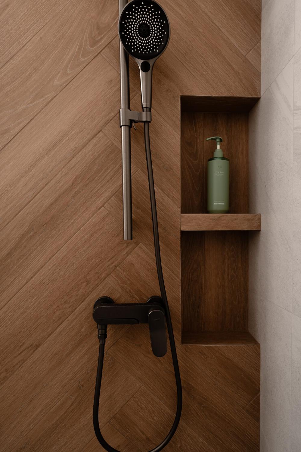 Modern Bathroom with Herringbone Tiling and Bathroom Storage