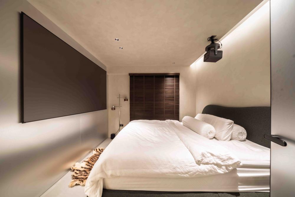 Industrial Bedroom with Cove Lighting and Bed