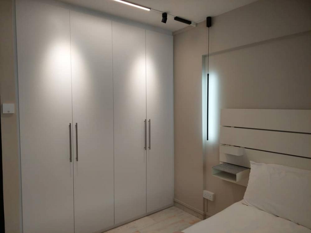 Minimalist Bedroom with Feature Wall and Drop Light