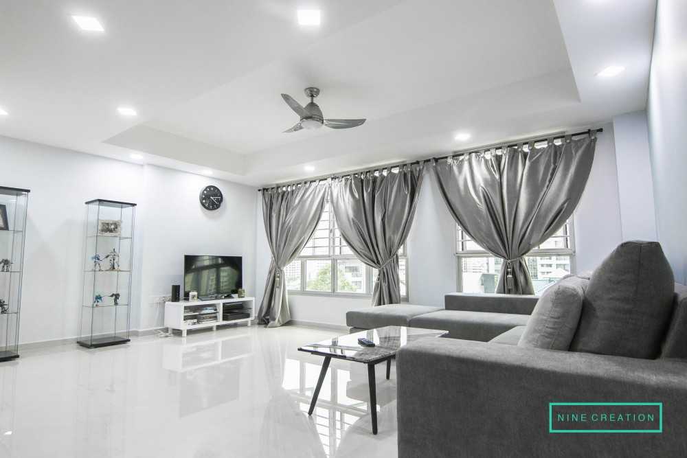 Modern Living Room with Bookshelf and Homogeneous Tiles