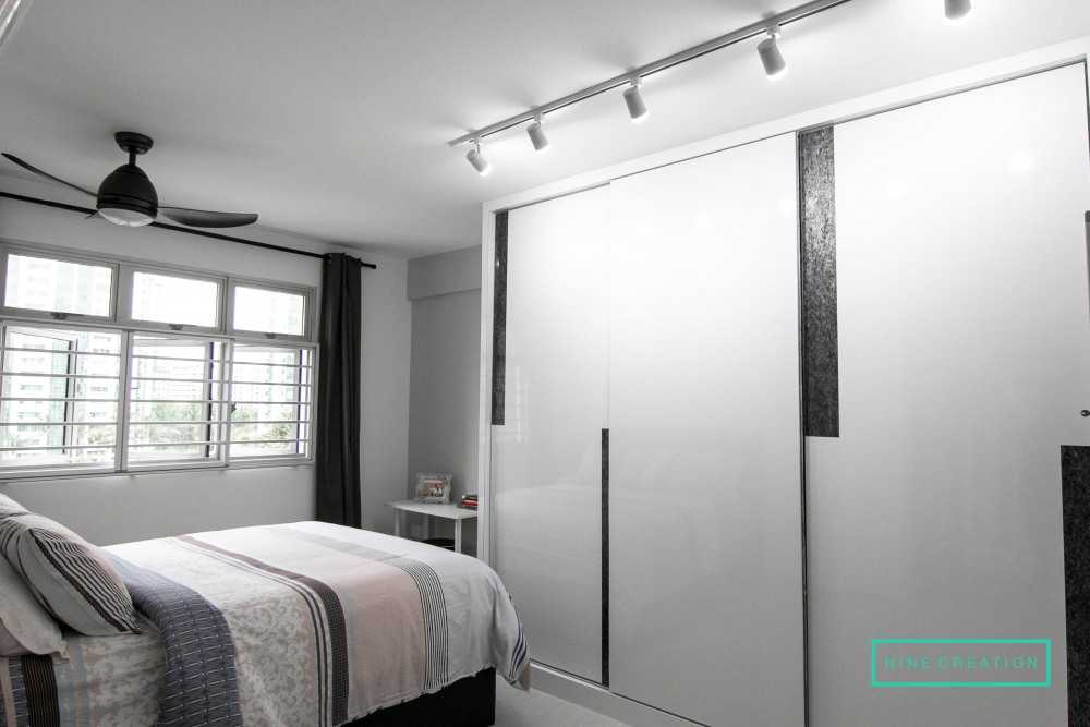 Modern Bedroom with Homogeneous Tiles and Wardrobe