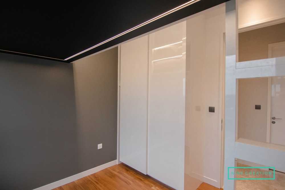 Contemporary Bedroom with Cove Lighting and Wardrobe